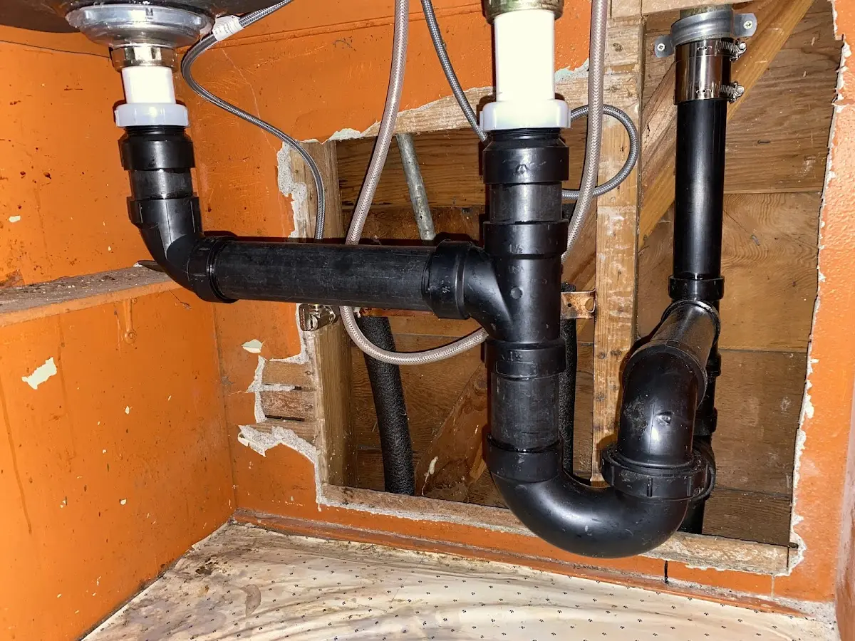 Professional Garbage Disposal Repair equipment and tools on the job in Waterford
